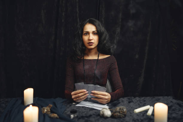 istock Portrait of fortune-teller in a dark room 1320645698