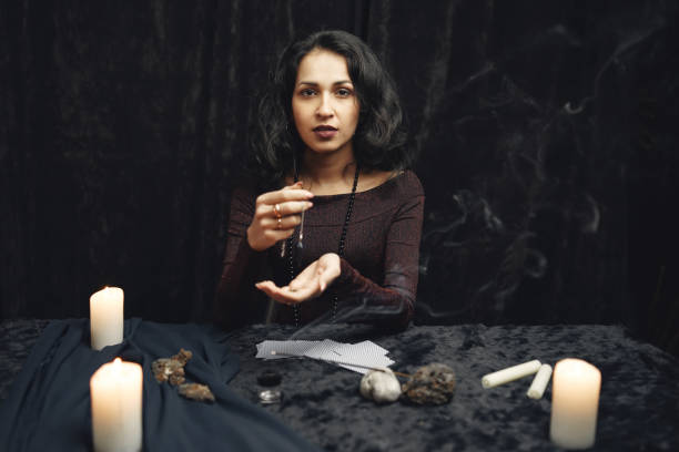 istock Portrait of fortune-teller in a dark room 1320645708