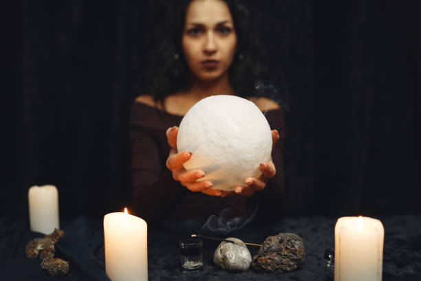 istock Portrait of fortune-teller in a dark room 1320645794