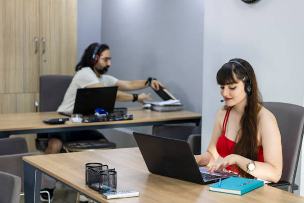 istock Happy young male customer support executive working in office 1320646909