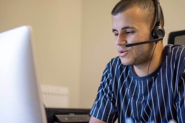 istock Happy young male customer support executive working in office 1320647049