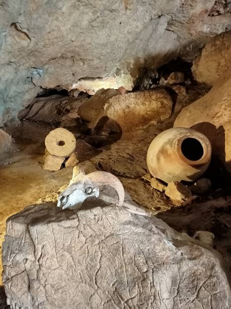 istock Underground mountain cave with river and stalactites and stalagmites 1320647759