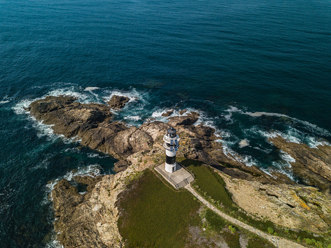 Aerial view of the lighthouse on Pancha island. Northern Spain in summer.