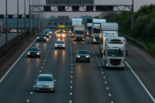 British motorway traffic Evening traffic on the British motorway M1 near junction 9. light commercial vehicle stock pictures, royalty-free photos & images