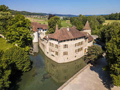 Seengen, Switzerland - May 18.2020: The Hallwyl Castle (founded in the late 12th century)  in Canton Aargau. Located on two islands in the River AabachIt, it is one of the most important moated castles in Switzerland.