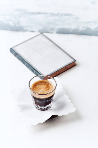 istock Coffee in glass cup on bright wooden background. Copy space. 1320651151