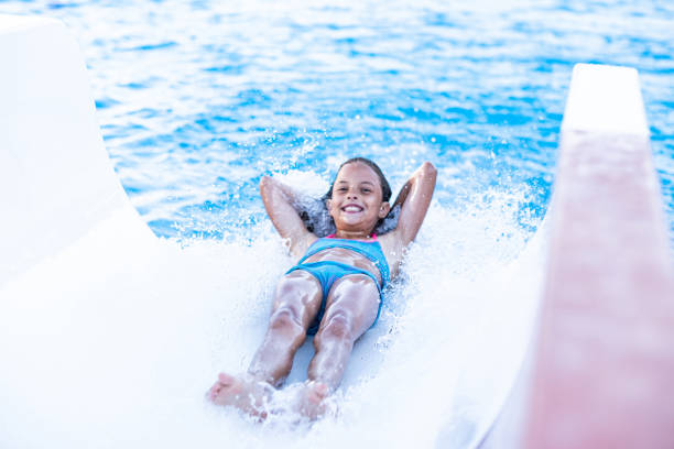 istock Girl enjoy sliding to the pool 1320653170