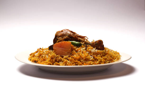 istock Isolated Spicy chicken biryani in white plate on white background, Delicious Indian, Bangladeshi and Pakistani Traditional Food. 1320656014