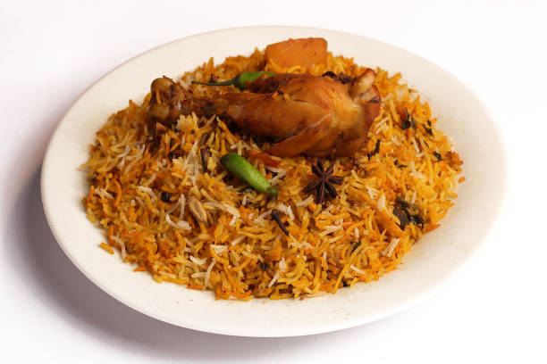 istock Isolated Spicy chicken biryani in white plate on white background, Delicious Indian, Bangladeshi and Pakistani Traditional Food. 1320656028