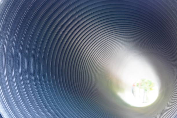 istock Passage through the pipe or  light at the end of the tunnel 1320657628