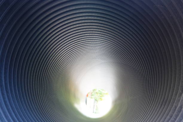istock Passage through the pipe or  light at the end of the tunnel 1320657667