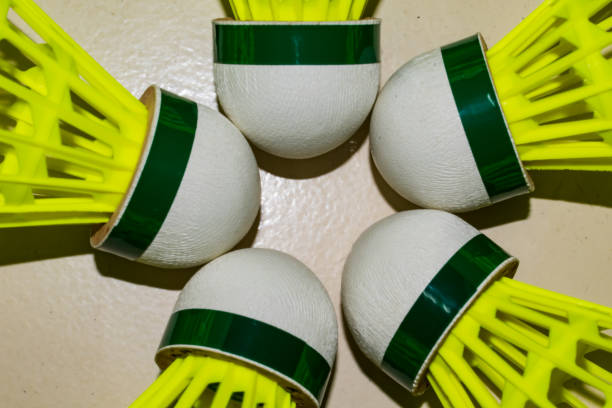 istock Nylon made yellow color badminton shuttlecock close view looking awesome placed on floor in different position. 1320657694