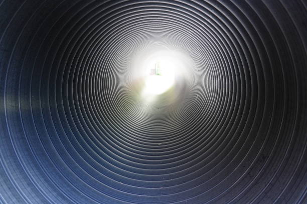 istock Passage through the pipe or  light at the end of the tunnel 1320657834