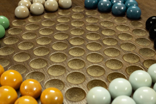 istock Marbles arranged in Sternhalma, commonly known as Chinese checkers is a strategy board game. Multiplayer board game with good fun time. 1320659256
