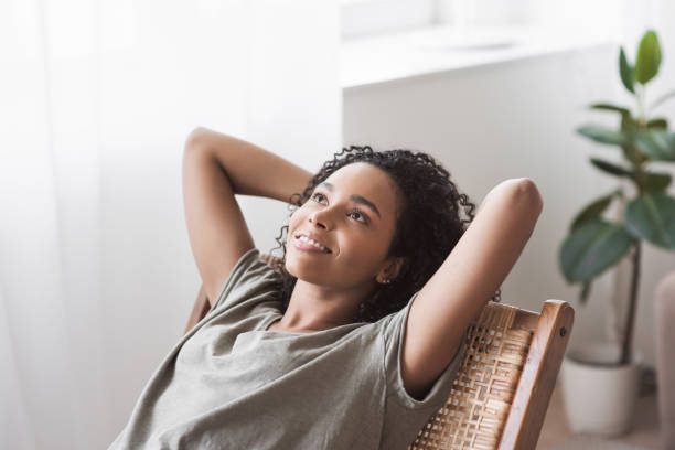 istock Relaxed young woman resting at home 1320659375