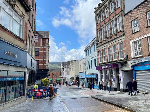 High street in Merthyr Tydfil in South Wales Merthyr Tydfil, Wales - May 2021: Shops and buildings in the high street in Merthyr Tydfil town centre merthyr tydfil stock pictures, royalty-free photos & images