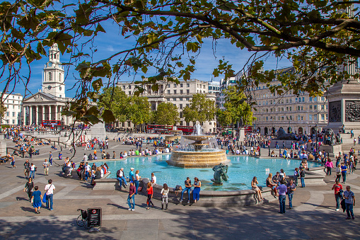Spring. Trafalgar Square is located downtown London