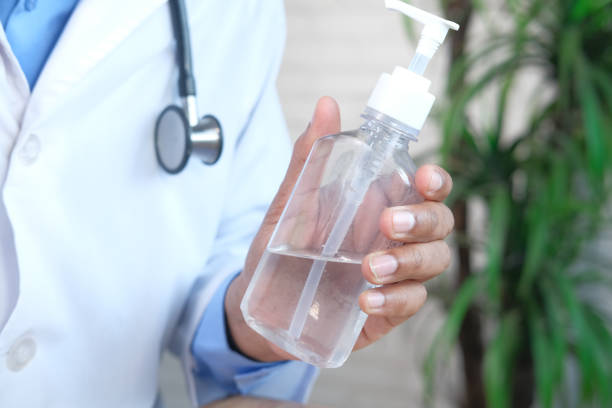 istock close up of doctor hand using sanitizer gel 1320660708