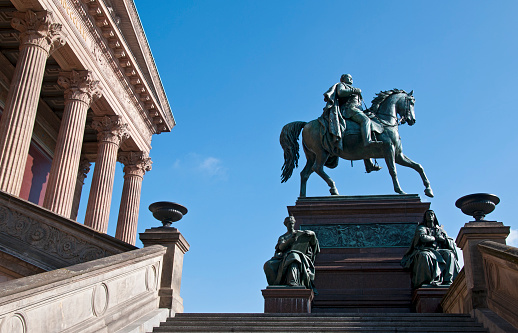 Equestrian statue of Frederick William IV, King of Prussia .  The statue is located on the stairway in front of the “Alte Nationalgalerie” in downtown Berlin.\n The bronze sculpture was created between 1875 and 1886 by Alexander Calandrelli based on a design by Gustav Blaeser.