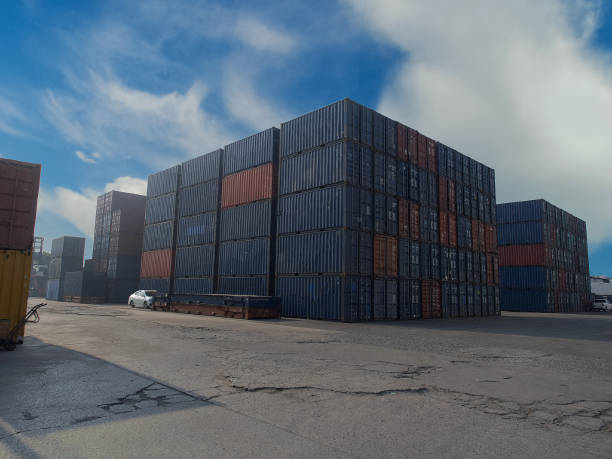istock Terminal warehouse mortgage cargo container orange color forklift crane trade engineer technology transportation company factory logistic ecommerce international import export.Sky blue cloud white 1320666708