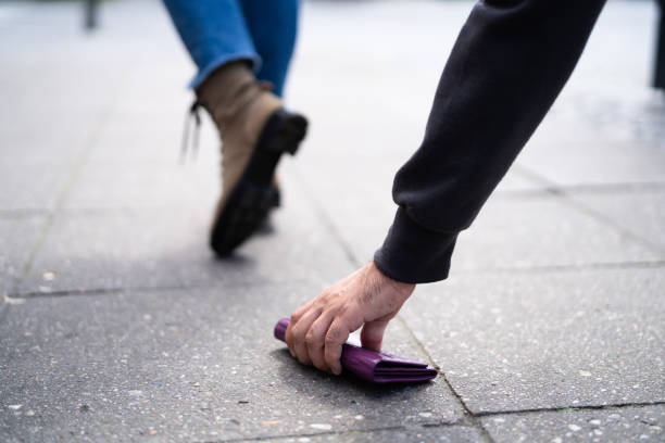istock Thief Picking Lost Personal Wallet With Money 1320666724