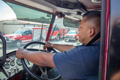 Firefighter driving truck