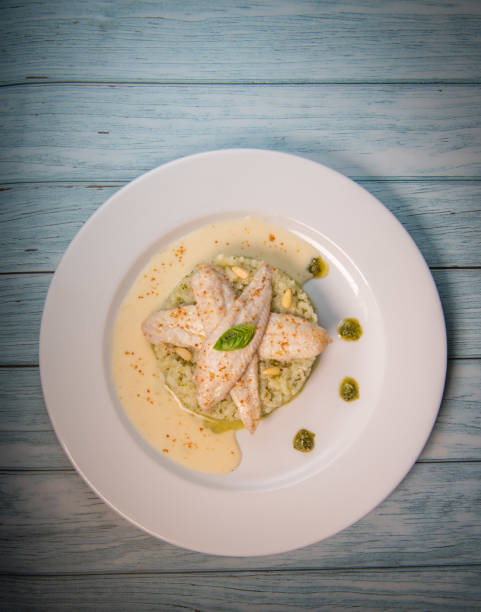 istock Baked sole fillet, risotto and pesto recipe 1320670890