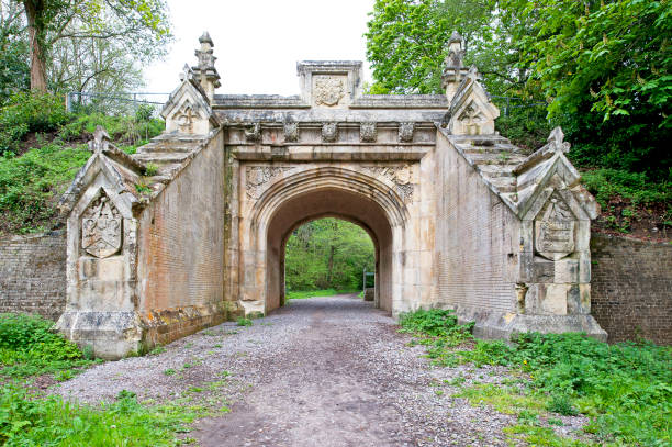 Lady Wimborne Bridge facade, Wimborne, Dorset, England, UK. Built in 1853 by the London and South Western Railway Bridge, this disused bridge, now a listed building, demonstrates historic power of landowners over the railway authorities who were forced to build ornate structures such as this to cross estate land such as Canford Magna Estate.