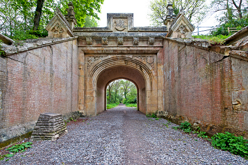 Through Lady Wimborne Bridge, Wimborne, Dorset, England, UK. Built in 1853 by the London and South Western Railway Bridge, this disused bridge, now a listed building, demonstrates historic power of landowners over the railway authorities who were forced to build ornate structures such as this to cross estate land such as Canford Magna Estate.