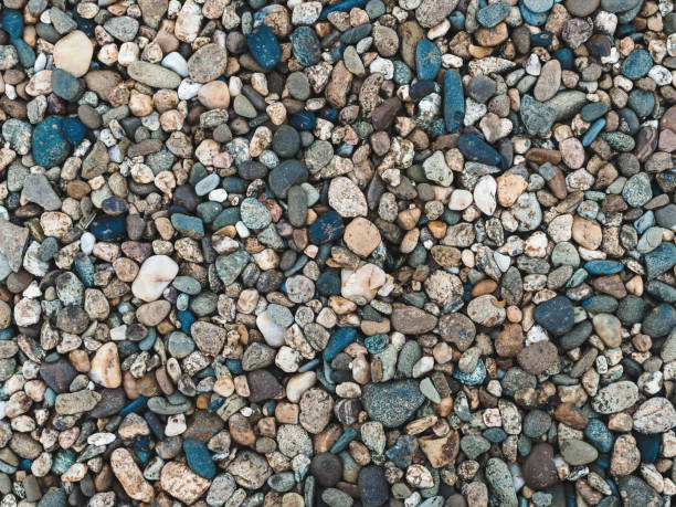 istock horizontal background: many small stones of different colors close-up 1320675107