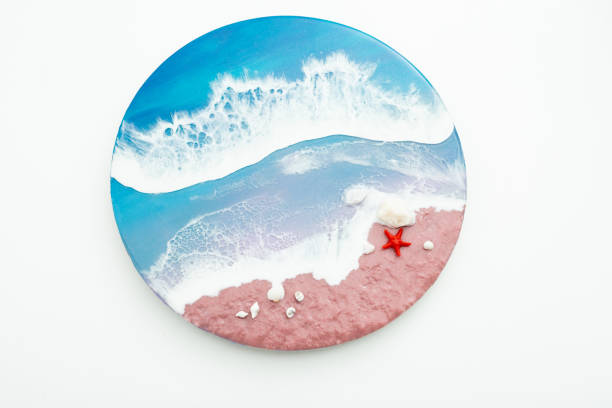 istock Resin art with blue ocean waves and beach with starfish. Epoxy paint art 1320675720