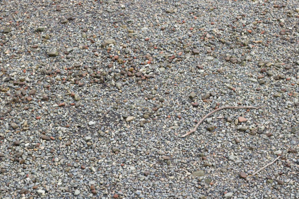 istock Full frame background of small grey stones and pebbles 1320677149