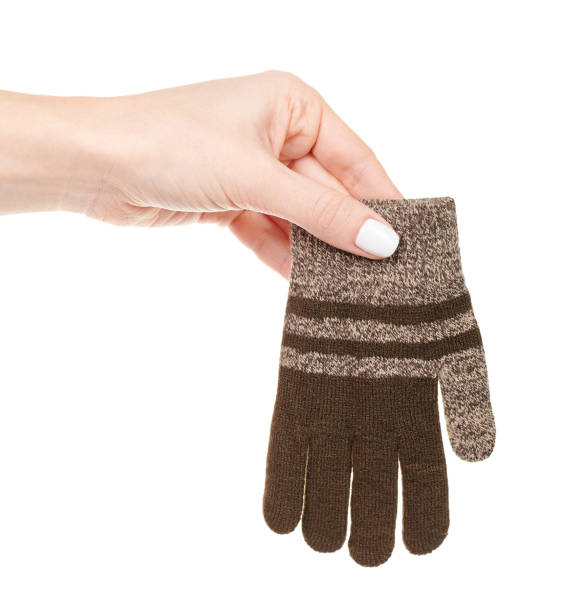 istock Hand with brown child gloves isolated on white background 1320677775