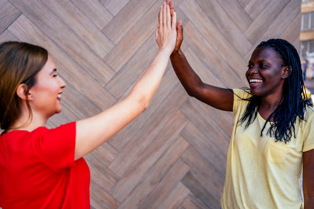 istock Female friends giving each other a high-five 1320684232