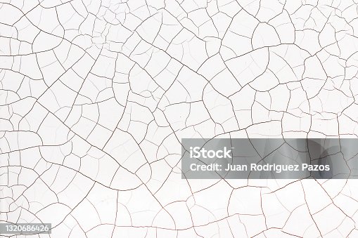 istock Cracked abstract white background 1320686426