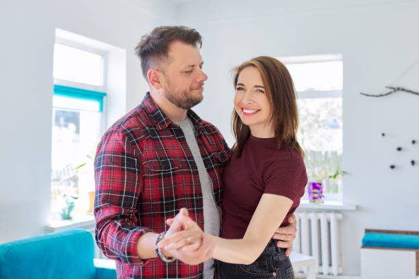 istock Happy romantic middle aged couple in love dancing 1320688346