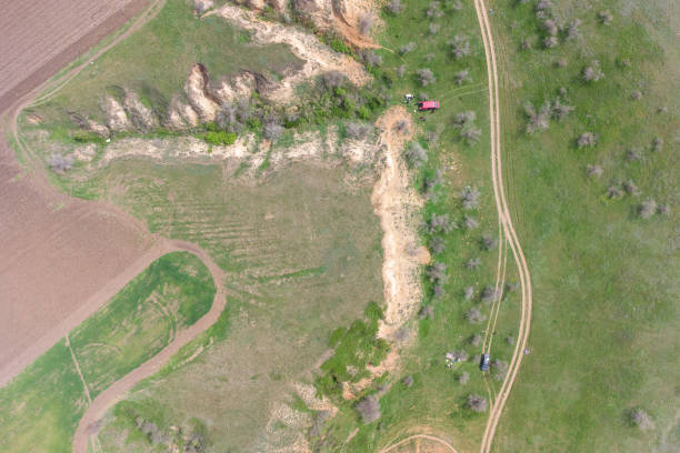 istock Freshly plowed field next to a steep sandy cliff. 1320688965