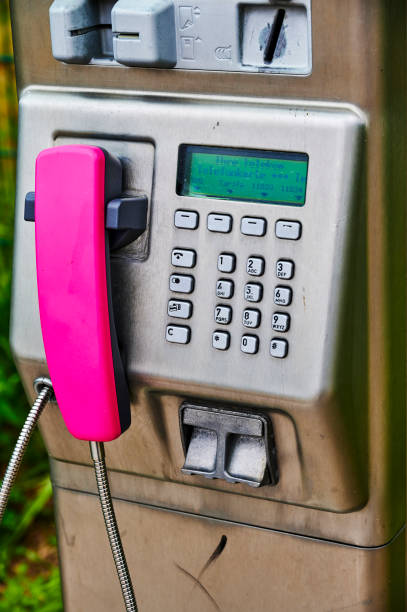 parte de um telefone público da deutsche telekom. - coin operated pay phone telephone communication - fotografias e filmes do acervo