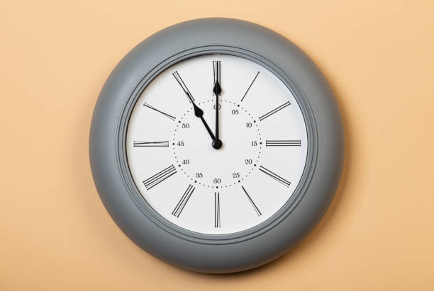 istock Roman Wall Clock show eleven o'clock 1320694709