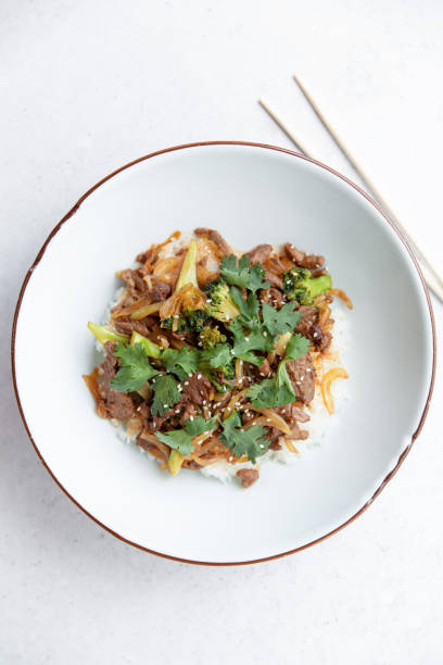 istock Asian meat with rice and parsley. Top view. 1320695905
