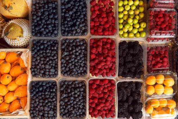 istock Fresh season berries on market. Top view. 1320695953