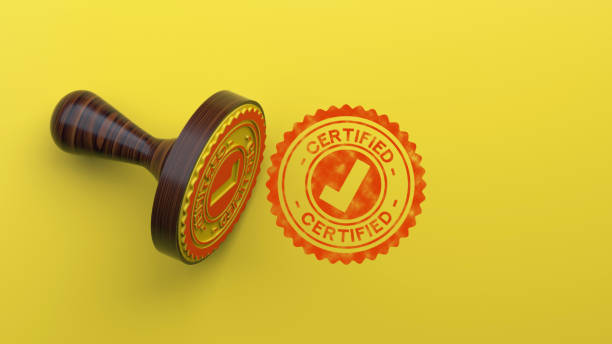 Certified Rubber Stamp On Yellow Background stock photo