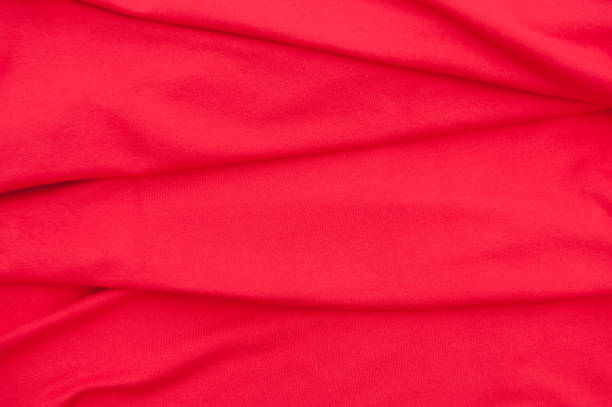 istock Fashion bright red cloth close up background 1320698008