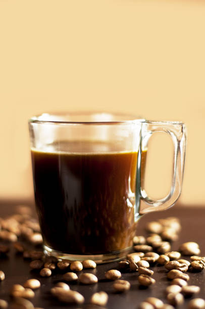 istock a cup of boiling coffee on a black wooden table 1320700973