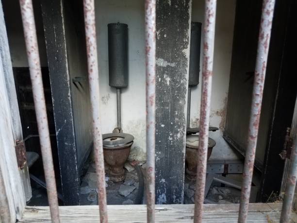 istock old damaged toilets in abandoned building or ruins 1320701073
