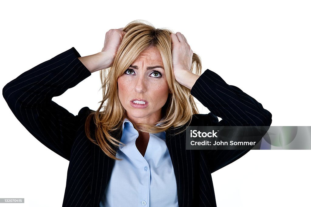 Unhappy businesswoman Unhappy businesswoman pulling hair out shot on white background Tearing Your Hair Out Stock Photo