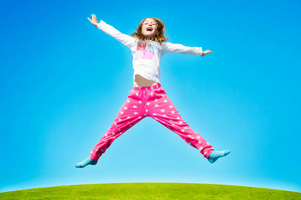 istock Young Girl Child High Jump 1320704881