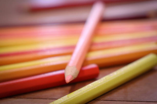 Group of colored pencils in different compositions