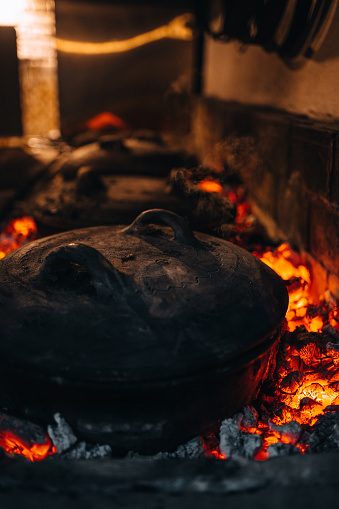 Cooked meal on fire in clay pot