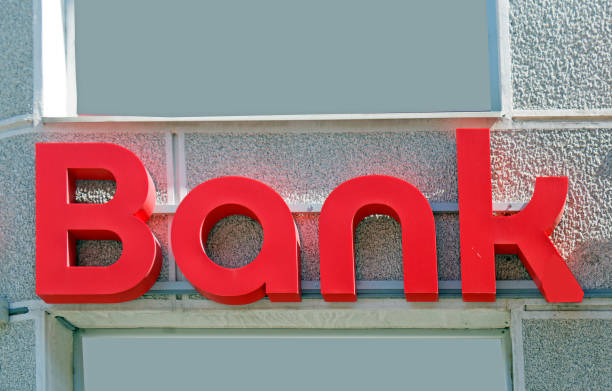 istock Bank sign on building facade 1320713267